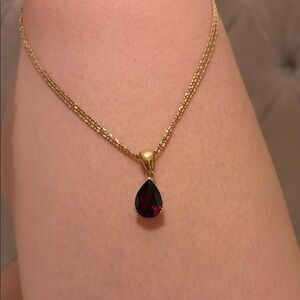 Elegant Gold Necklace with Red Teardrop Pendant